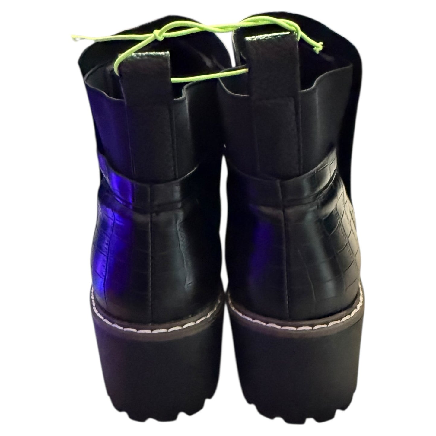 Back of Black platform boots with blue soles on a white background