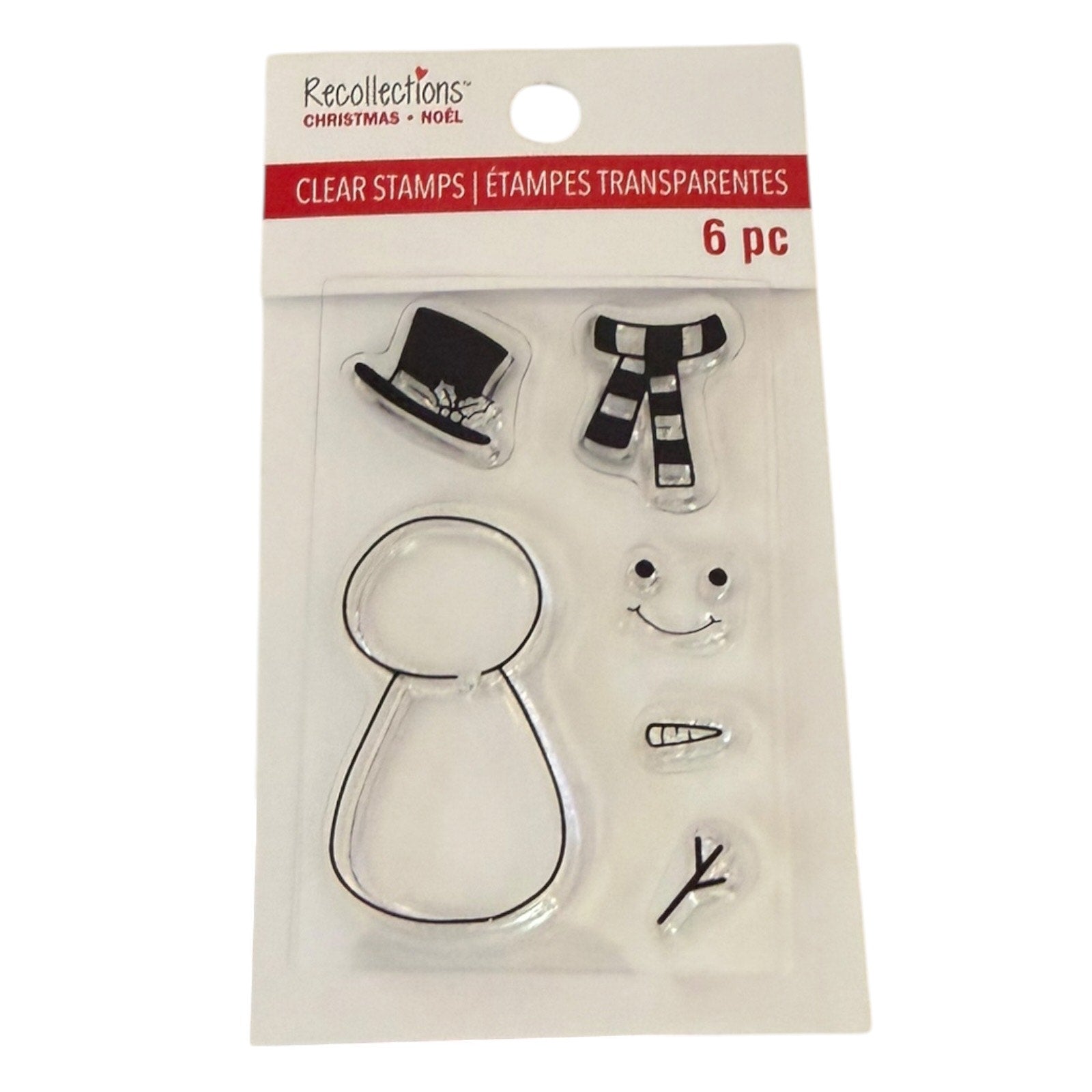 Recollections Christmas Clear Stamps set in retail packaging, featuring 6 transparent stamps including a top hat, striped scarf, snowman body, carrot, smiley face, and branch.