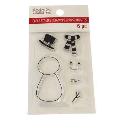Recollections Christmas Clear Stamps set in retail packaging, featuring 6 transparent stamps including a top hat, striped scarf, snowman body, carrot, smiley face, and branch.