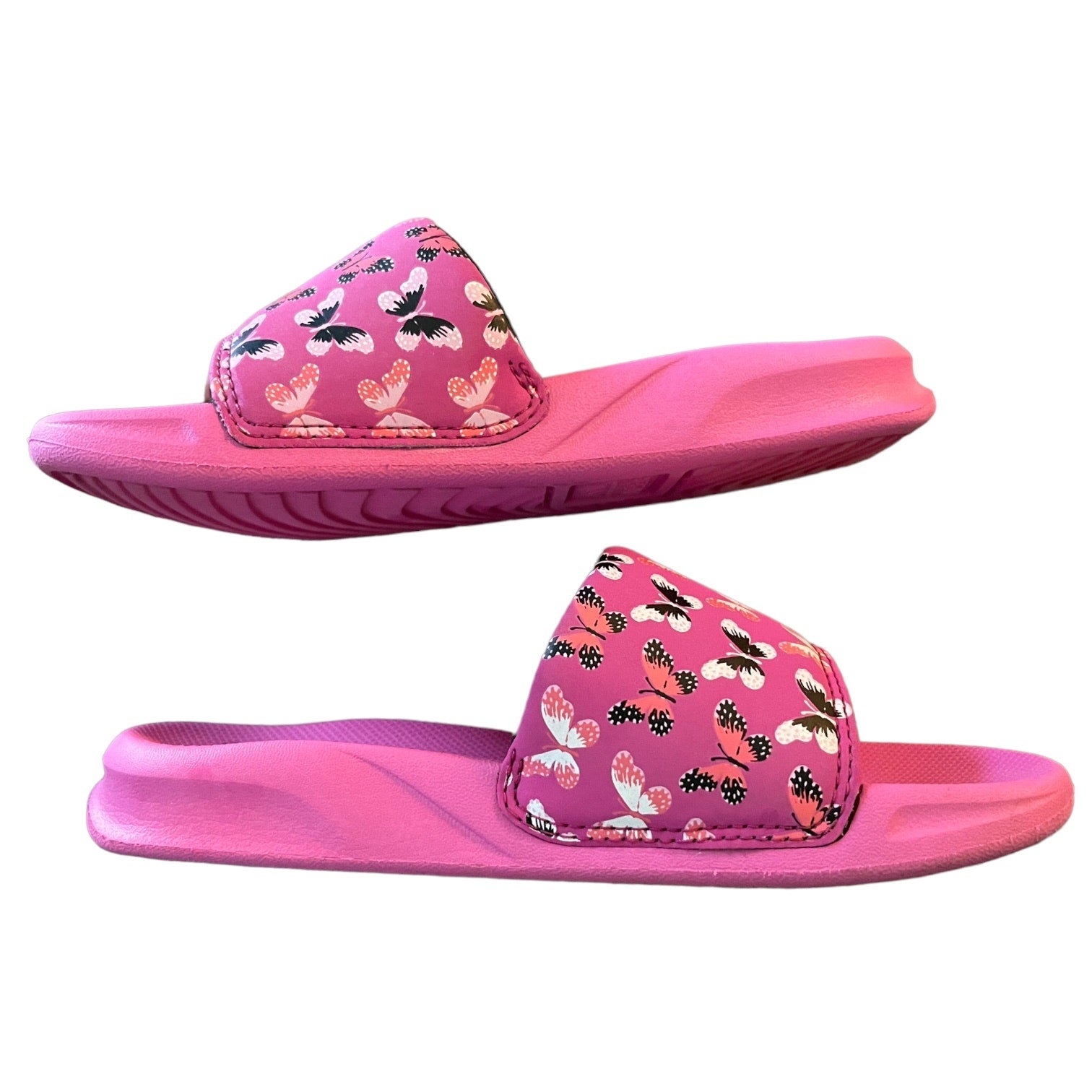 Side view Pink slides with floral pattern on a white background