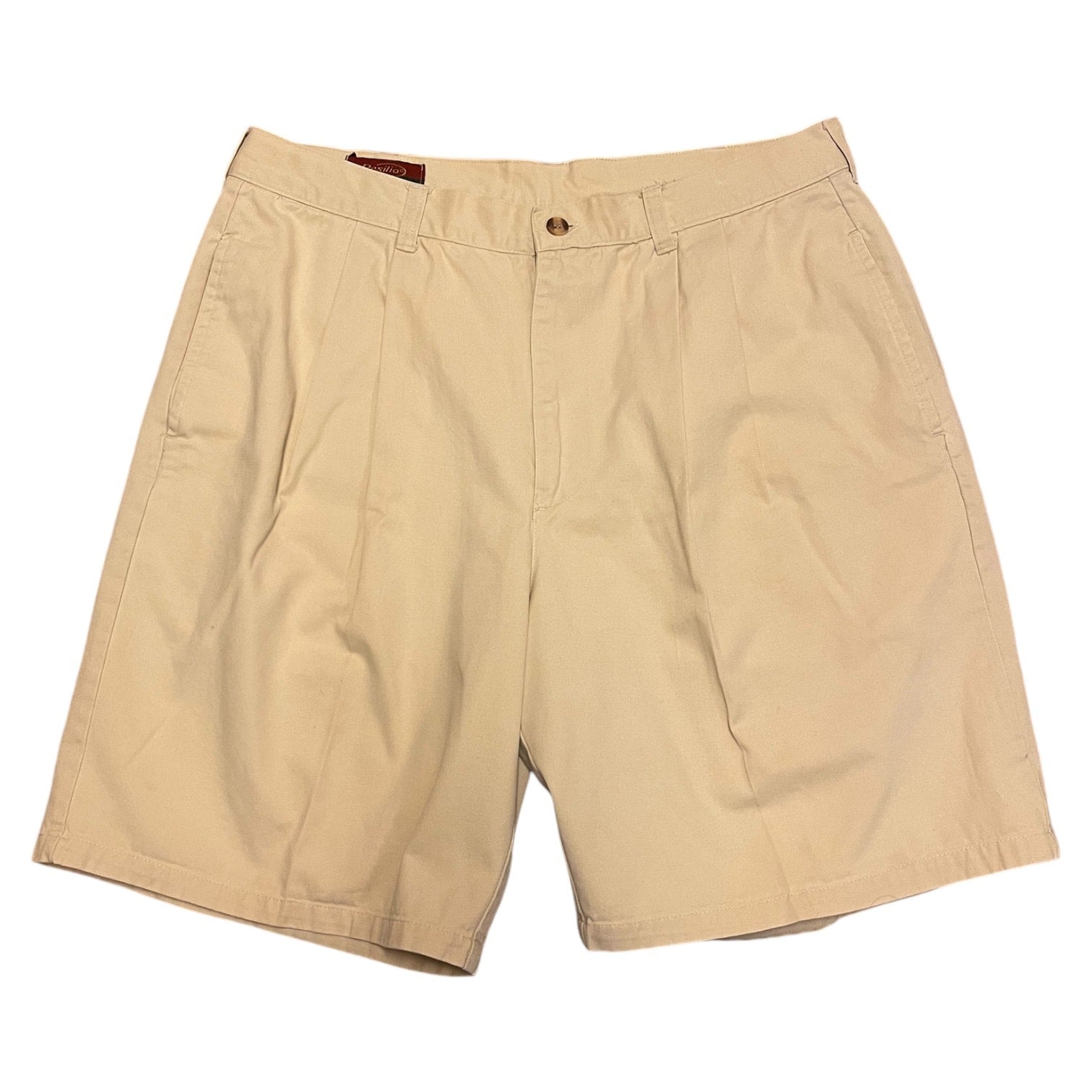 A pair of beige Resilio Sport cotton men's shorts with a button/zip front and two back pockets.