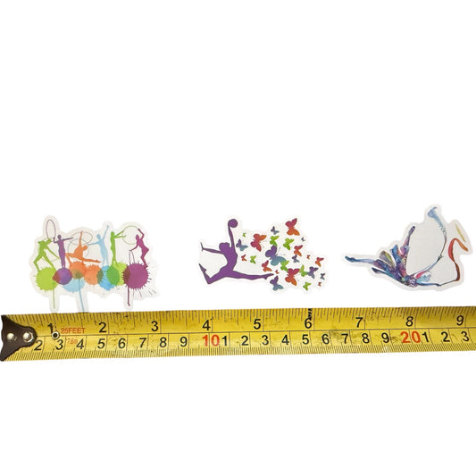 Colorful gymnastics-themed stickers with a tape measure for scale on a white background