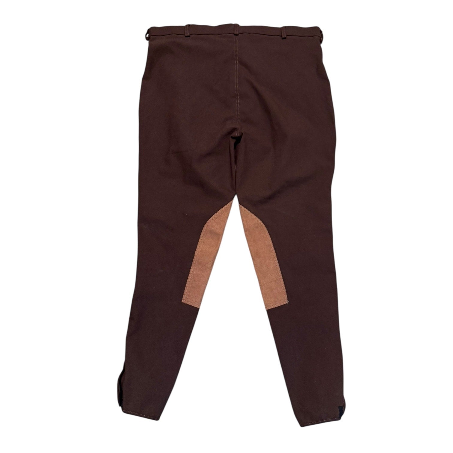 Back Of Brown riding pants with a patch on a white background