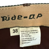 Label with 'Ride-A-P' branding and washing instructions on a brown background