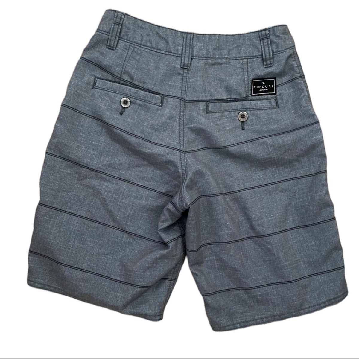 Gray striped shorts with a black brand patch on the back pocket, photographed flat against a white background.