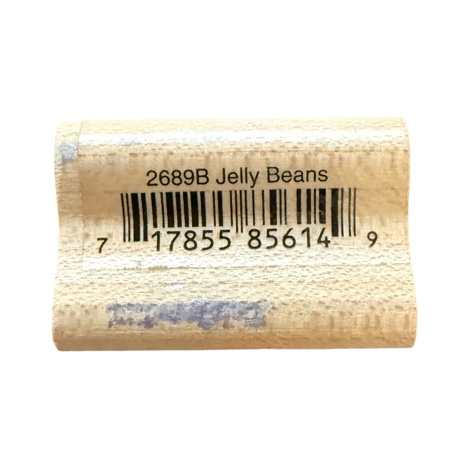 Wood block with a printed barcode and the text '2689B Jelly Beans' on a white background.