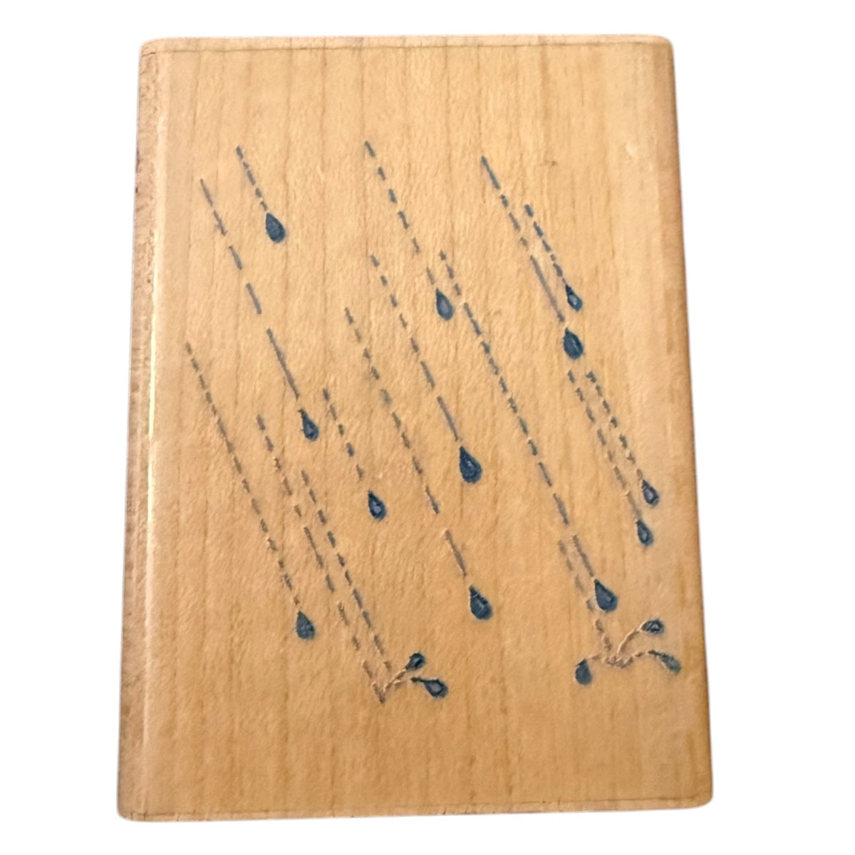 A rectangular wood stamp with a light natural wood grain surface, decorated with blue rain drops shown against a plain white background.