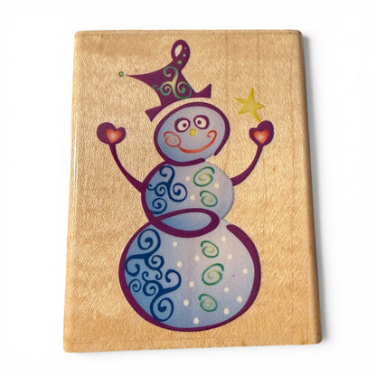 Snowman on a wooden block stamp with a white background