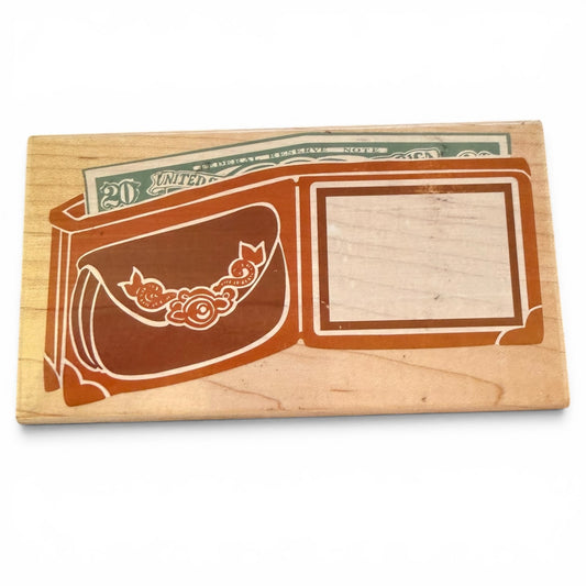Wooden block with wallet and a slot for a twenty-dollar bill on a white background