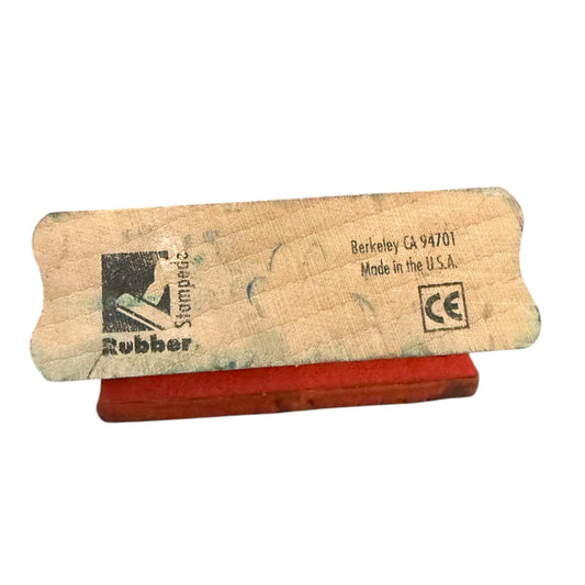Rubber stamp with a Rubber Stampede and words on a white background
