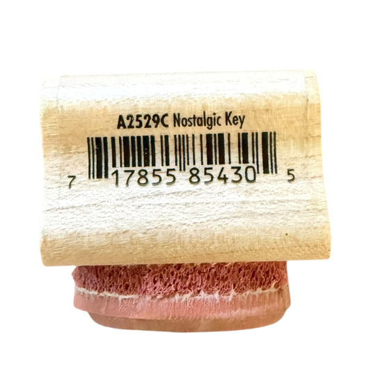 Wooden stamp with a barcode label on a white background