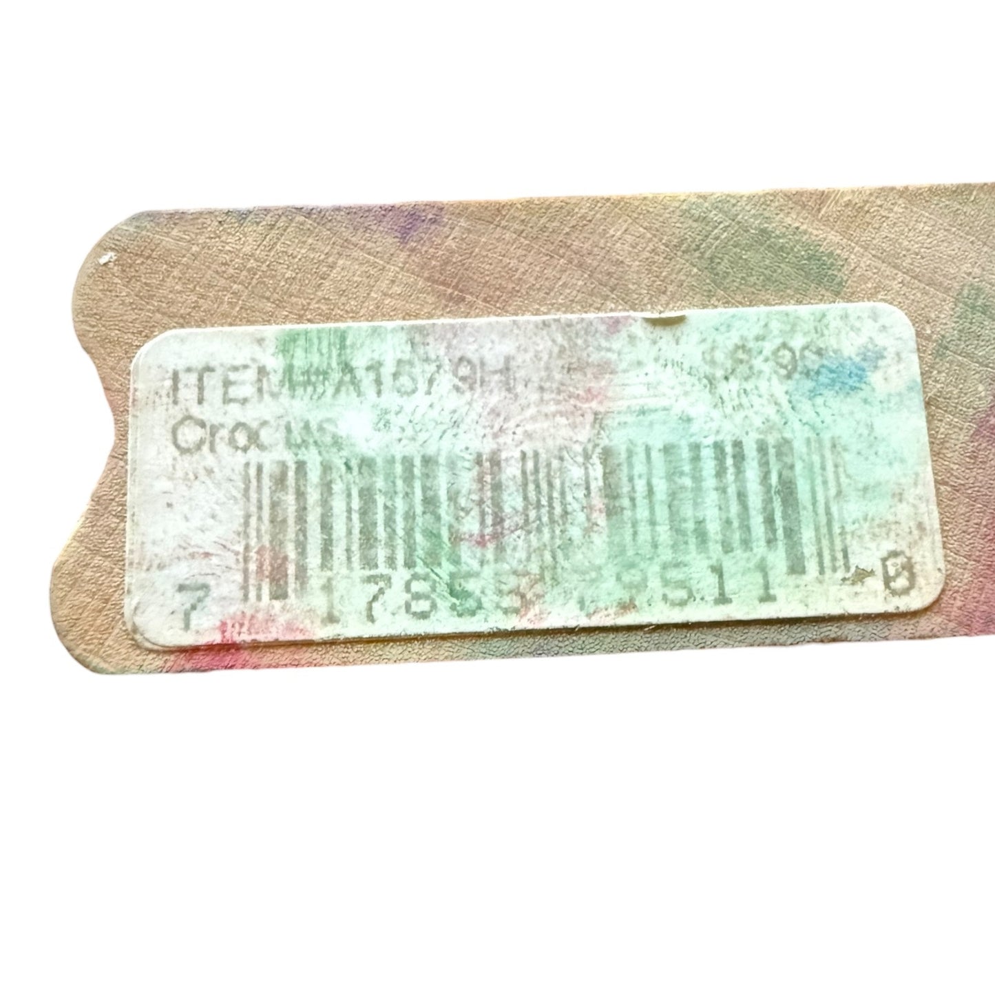 Product tag with barcode and text on a textured surface