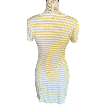 Back of green and white striped dress on a mannequin against a white background