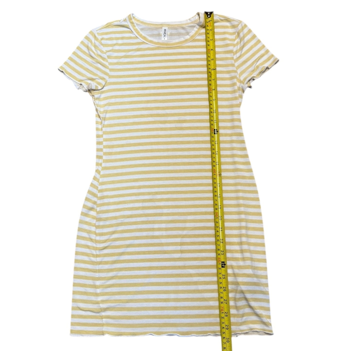 Green and white striped dress with a measuring tape on a white background