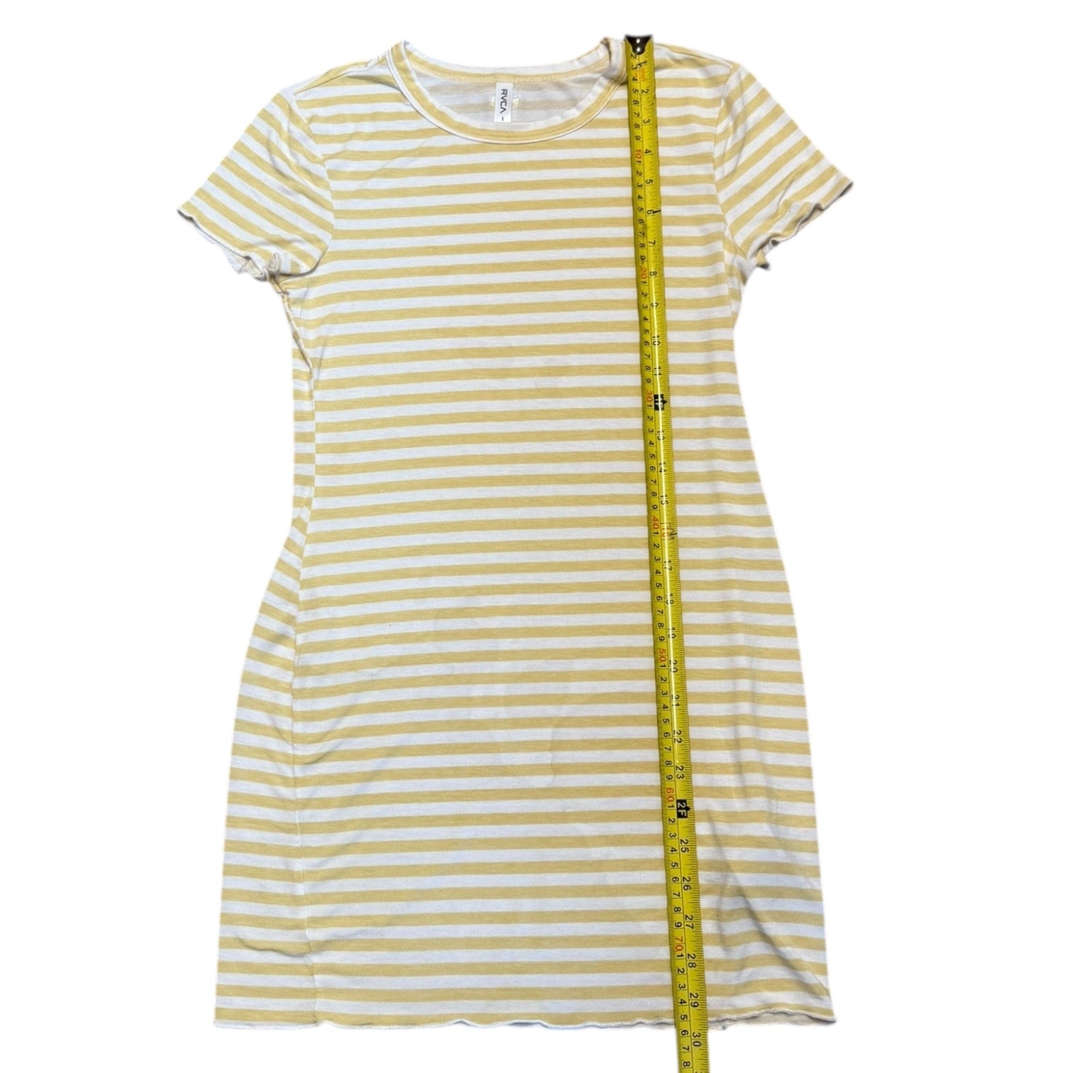 Green and white striped dress with a measuring tape on a white background