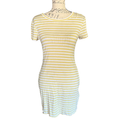 Green and white striped dress on a mannequin against a white background
