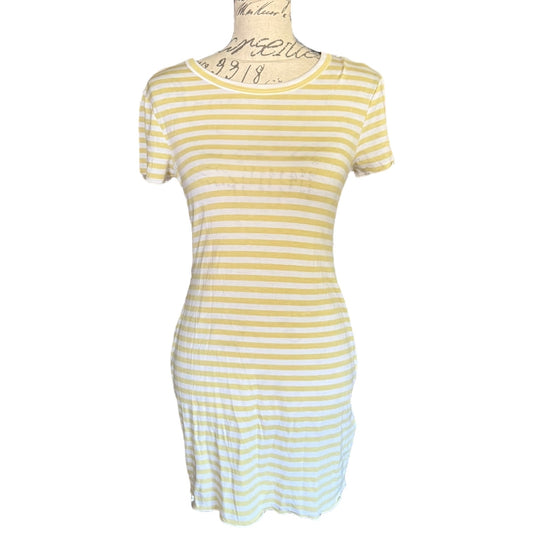 Green and white striped dress on a mannequin against a white background