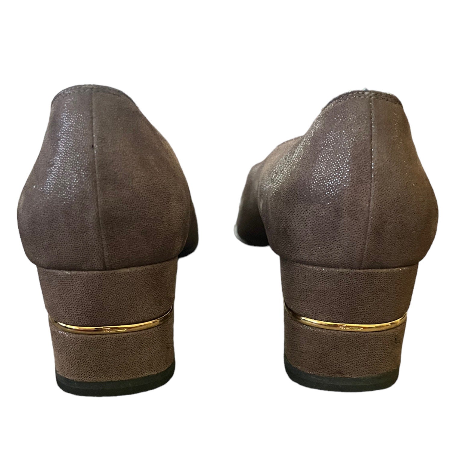 A pair of women's brown suede pumps shown from the back, featuring a stacked block heel with a thin gold metallic accent band.