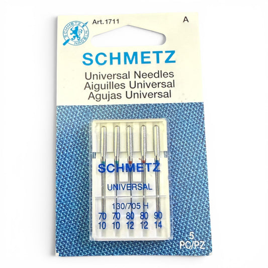 Schmetz needle package with five needles on a blue textured background