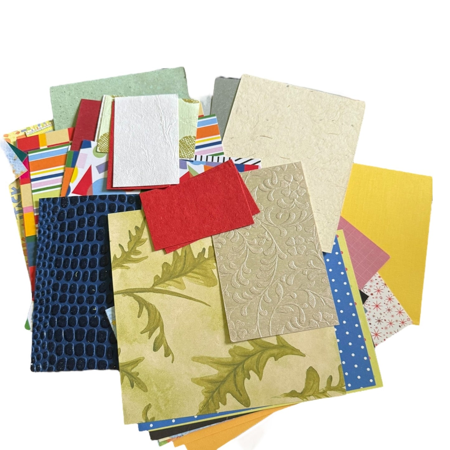 Collection of various textured and patterned paper sheets on a white background