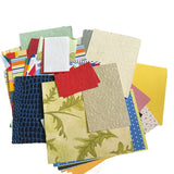 Collection of various textured and patterned paper sheets on a white background