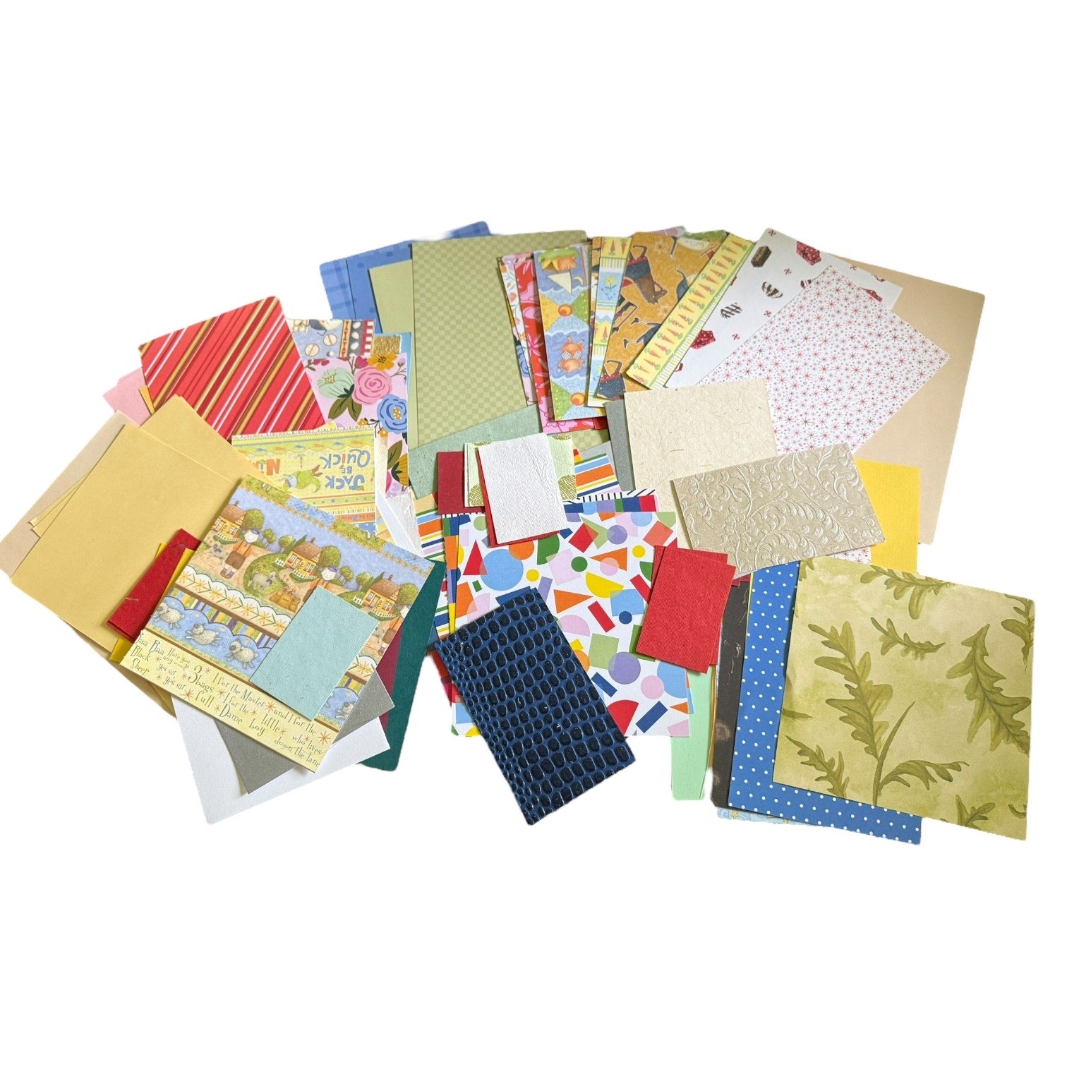 Assortment of colorful paper sheets with various patterns on a white background