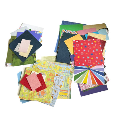 Assorted colorful paper sheets on a white background