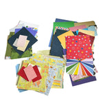 Assorted colorful paper sheets on a white background