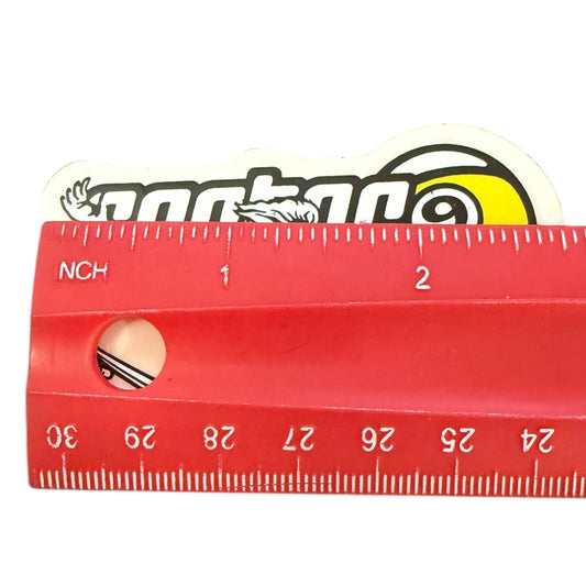 Red ruler with measurements and a skateboard deck sticker with a brand logo on a white background