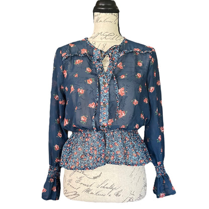 Front of Floral blouse on a mannequin with a white background