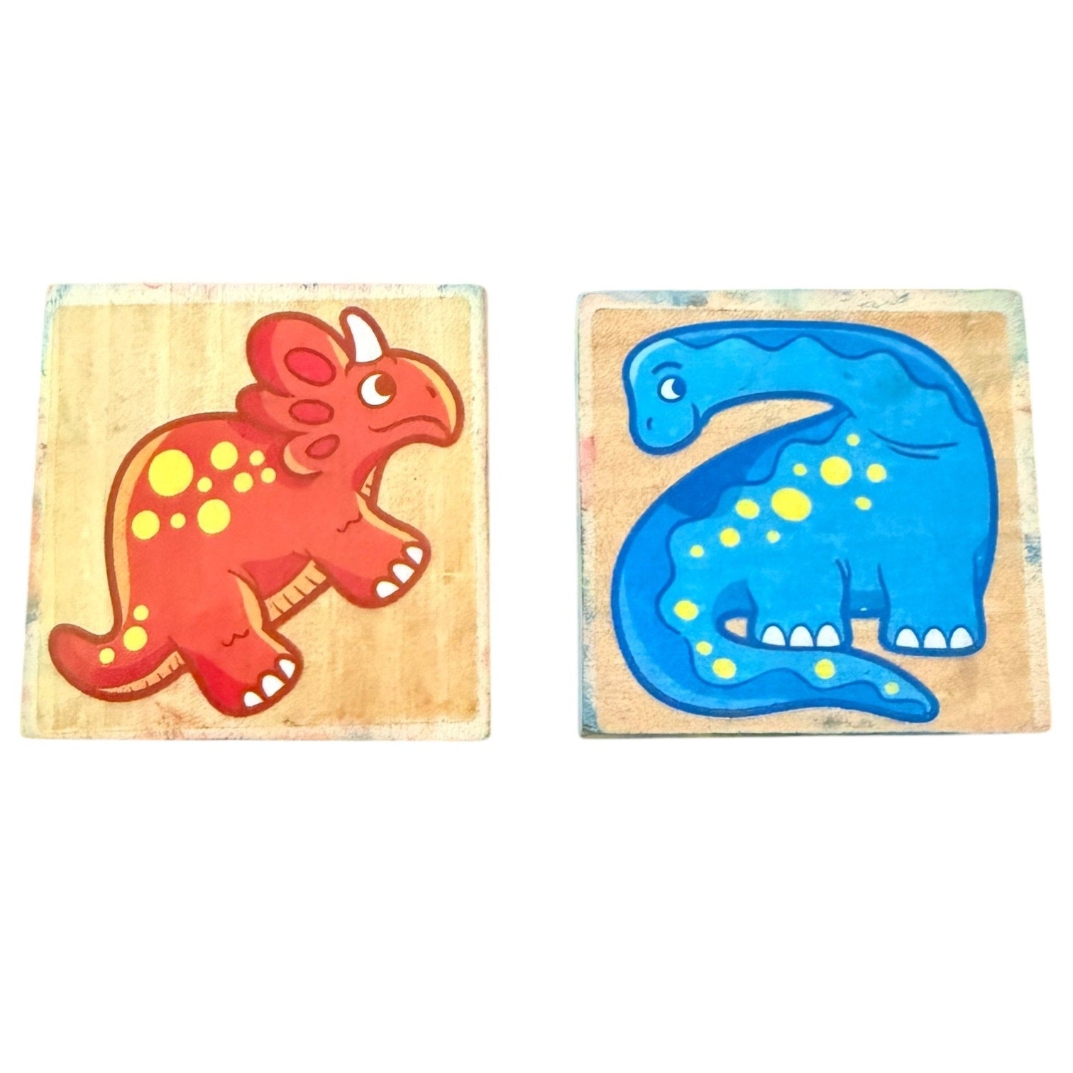 Two wooden stamps with colorful dinosaur designs on a white background