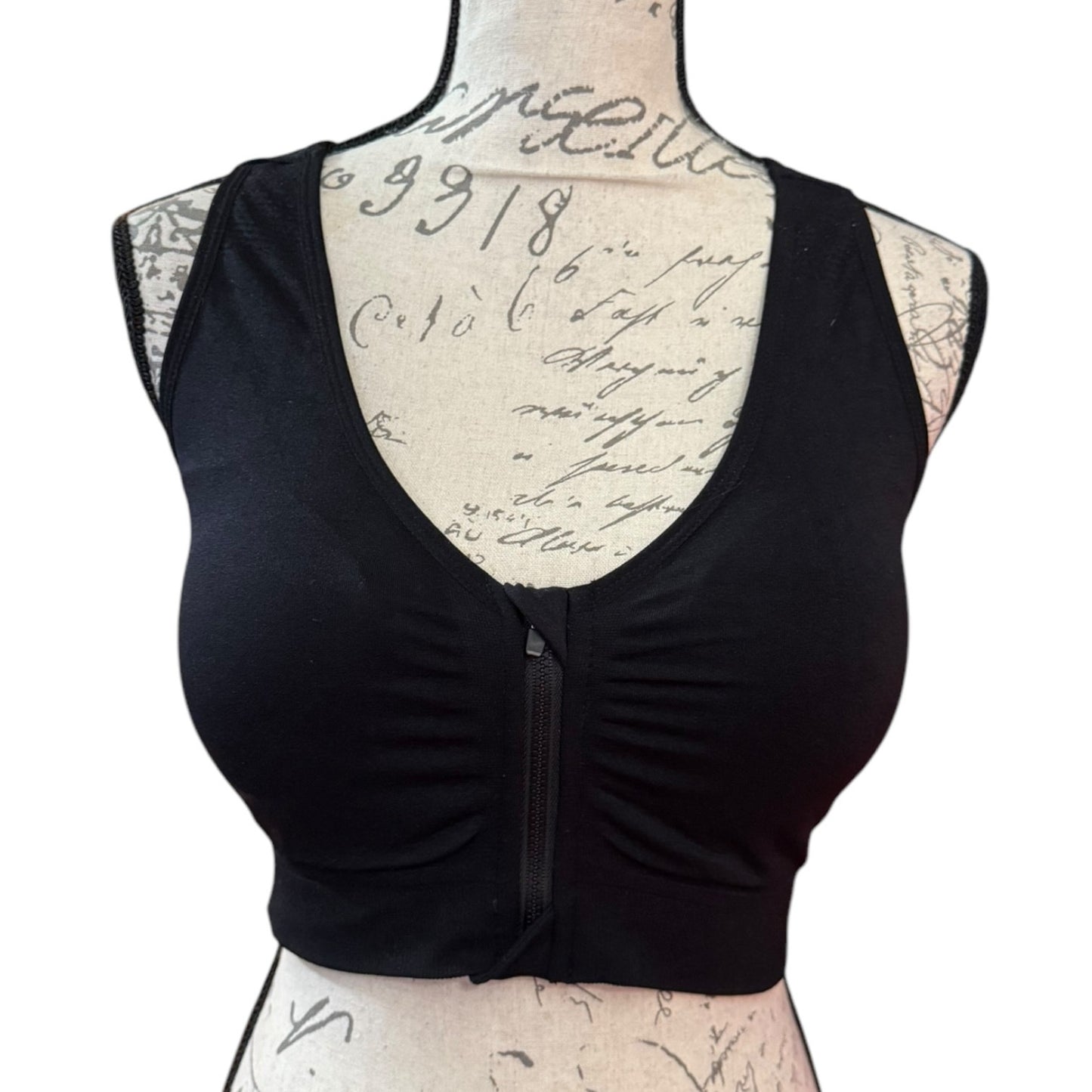 Black sports bra front on a mannequin with a white background