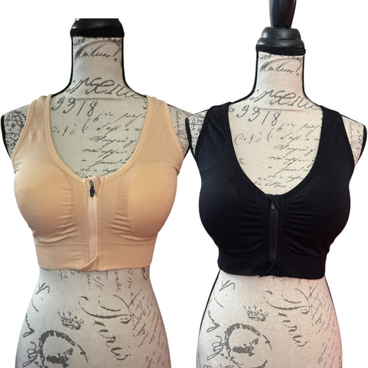 Beige and black sports bra front on mannequins with a vintage-style background.