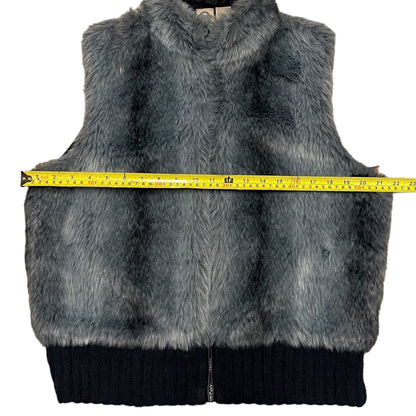 Blue-Gray fur vest with a measuring tape on a white background