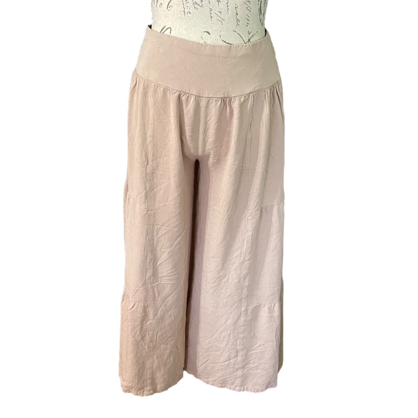 A pair of wide-leg cropped pants, displayed on a mannequin torso against a plain white background.