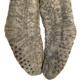 Pair of gray knitted socks with a pattern on a white background