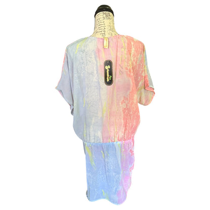 Back of Colorful tie-dye shirt on a mannequin with a white background
