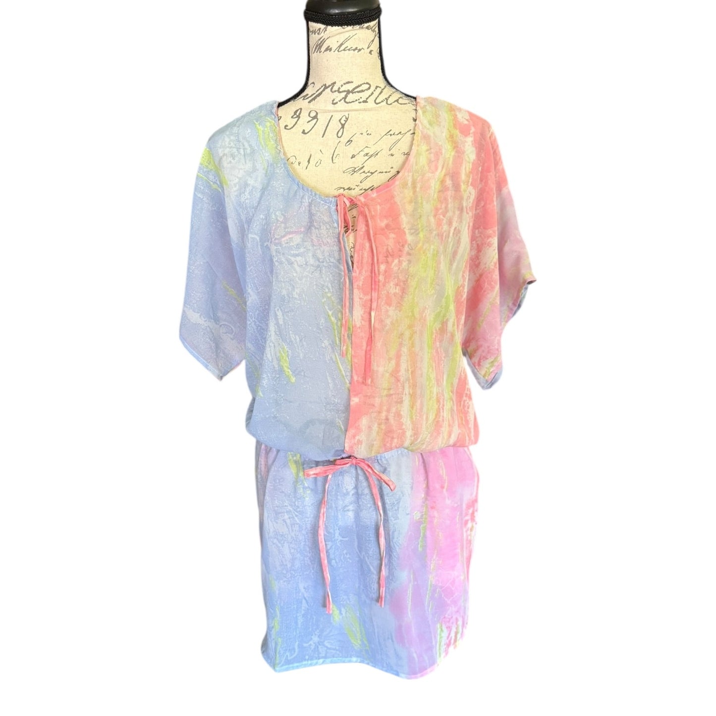 Pastel tie-dye outfit on a mannequin against a white background