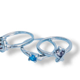 3 Silver rings with gemstones on a white background