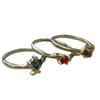 Three silver rings with gemstones on a white background