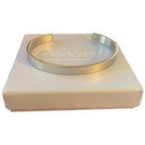 Silver cuff exterior sitting on a box