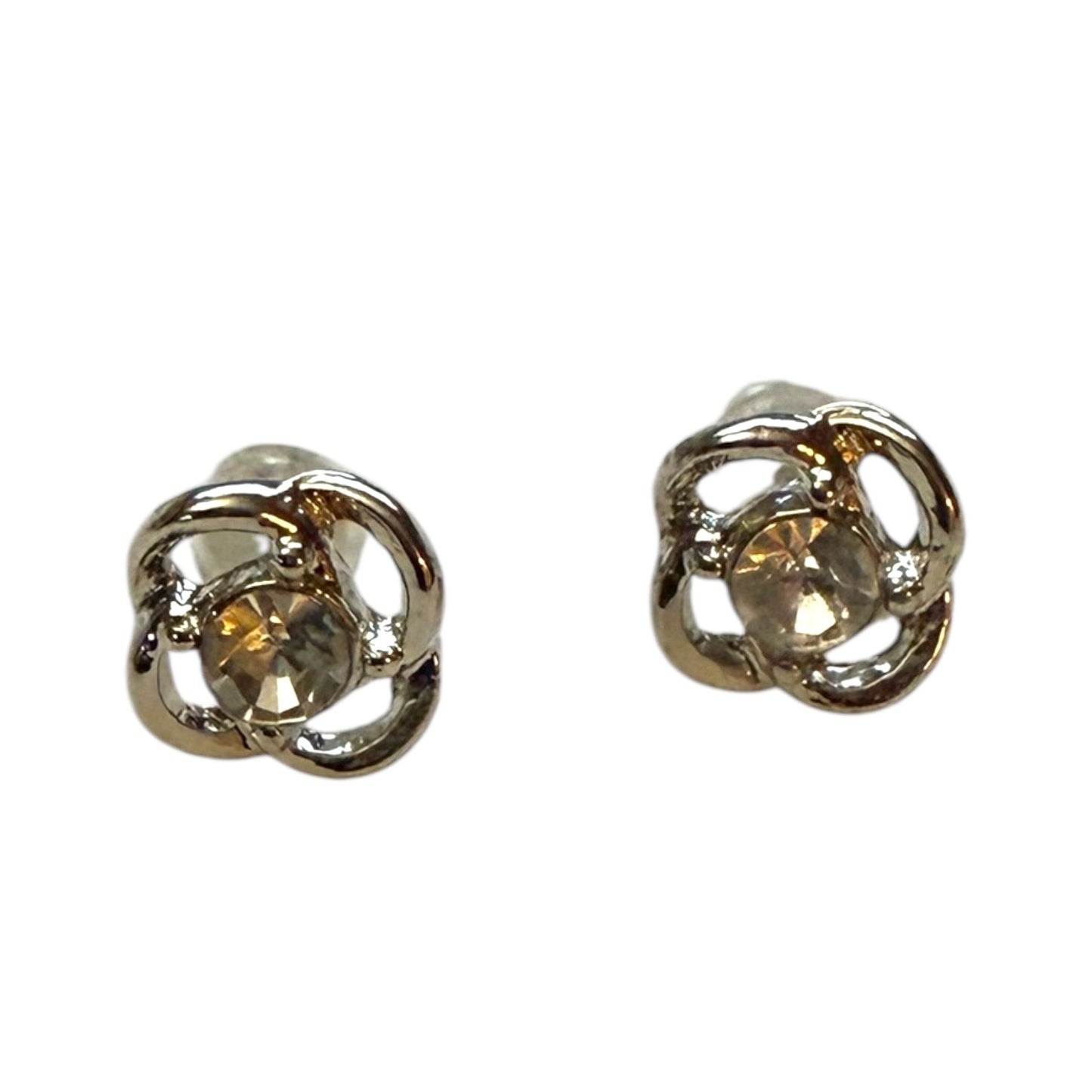 A pair of silver-toned stud earrings with a central faceted gemstone in a flower design, shown on a plain white background.