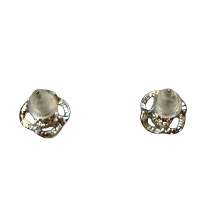 A pair of silver-toned earrings with textured, back of flower design earrings, shown on a plain white background.