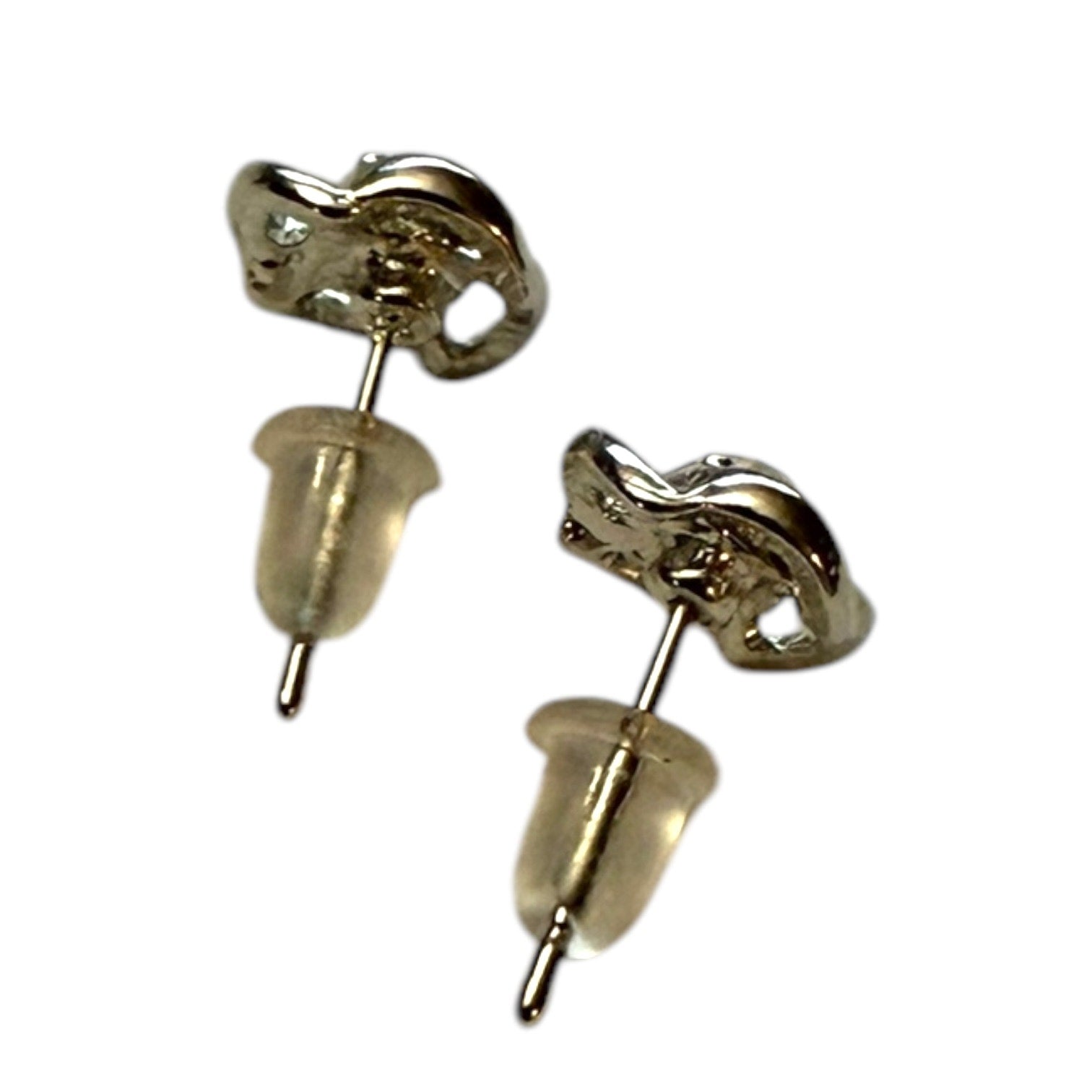 A pair of stud earrings with a small clear gemstone, shown from the side back to display the metal setting and backing, on a plain white background.