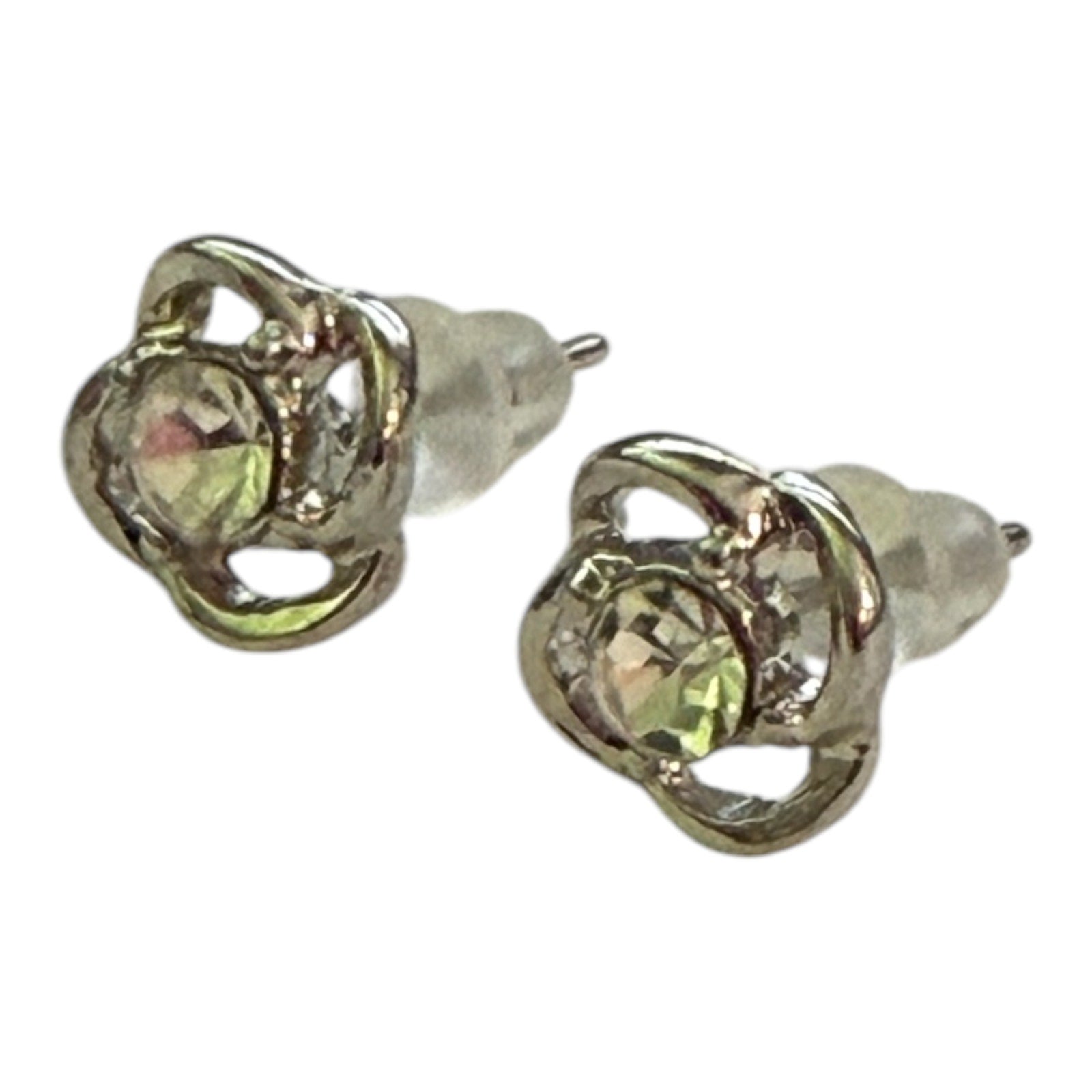 A pair of silver-toned stud earrings with a central iridescent, color-shifting gemstone in a floral or starburst setting, shown on a plain white background.