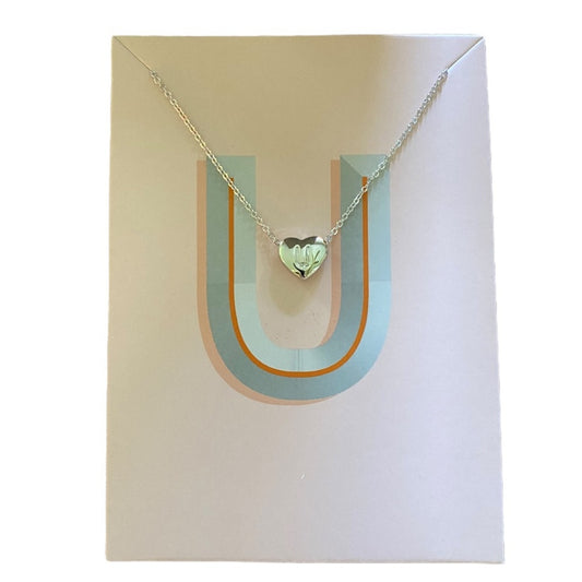 Necklace with a heart-shaped pendant on a U-shaped card