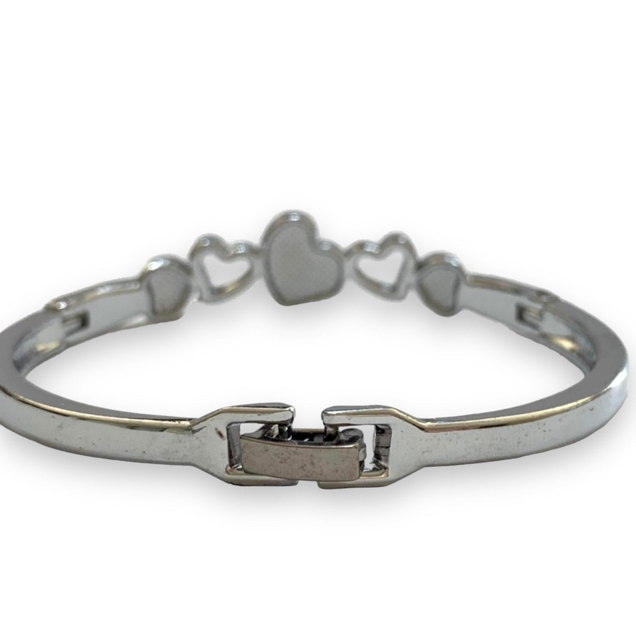 Silver bracelet with heart-shapes and back with clasp on a white background