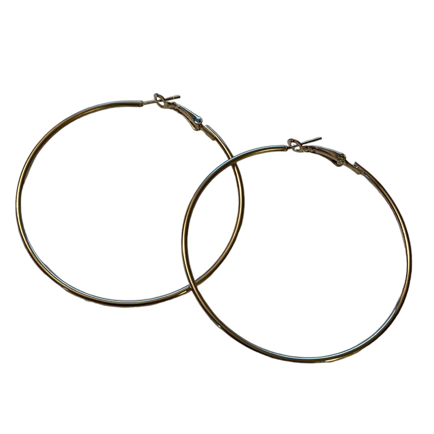 A pair of large, hoop earrings with a polished silver-tone finish, displayed against a solid white background.
