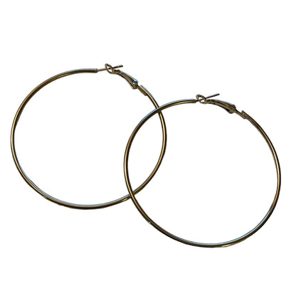 A pair of large, hoop earrings with a polished silver-tone finish, displayed against a solid white background.