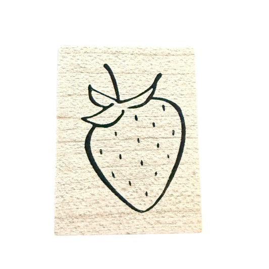 Rubber stamp with a black outline of a strawberry on a beige background